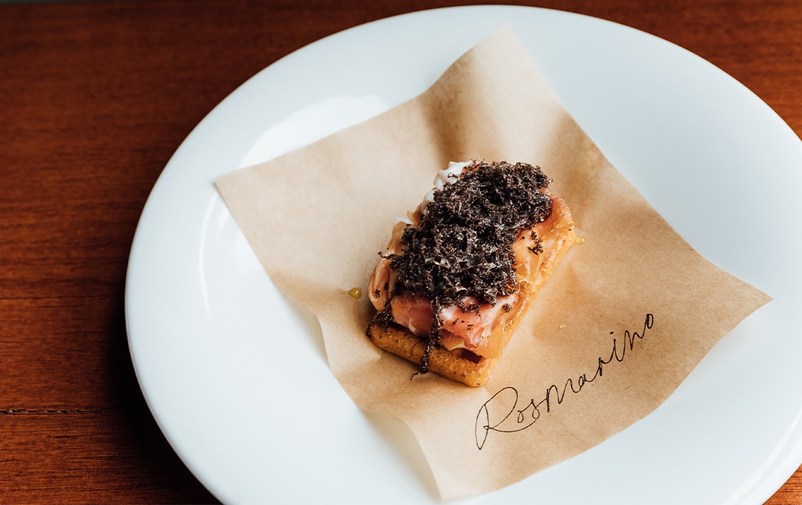 a bar bite dish topped with truffle